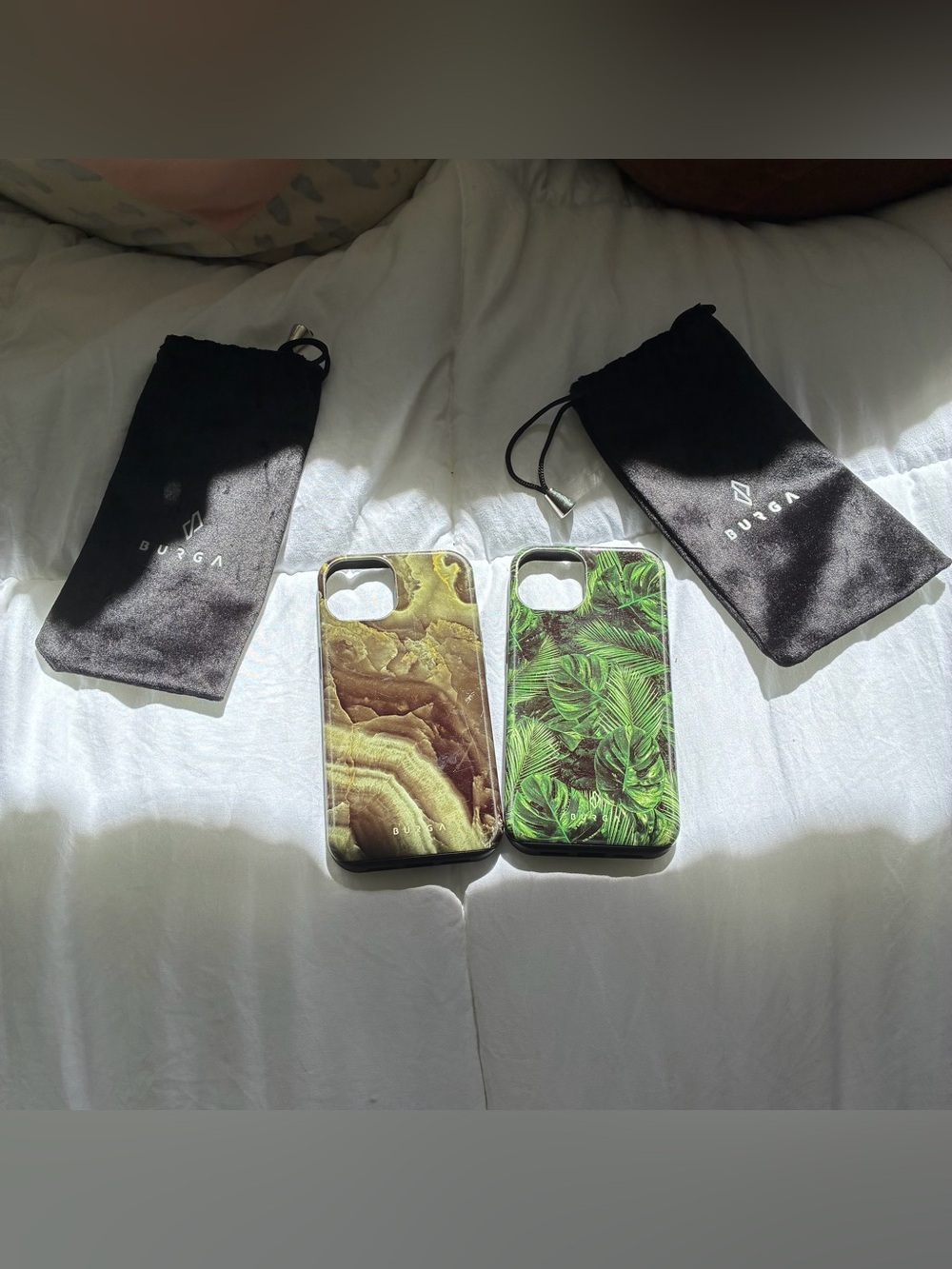 2 BURGA iPhone 13 phone cases with bags